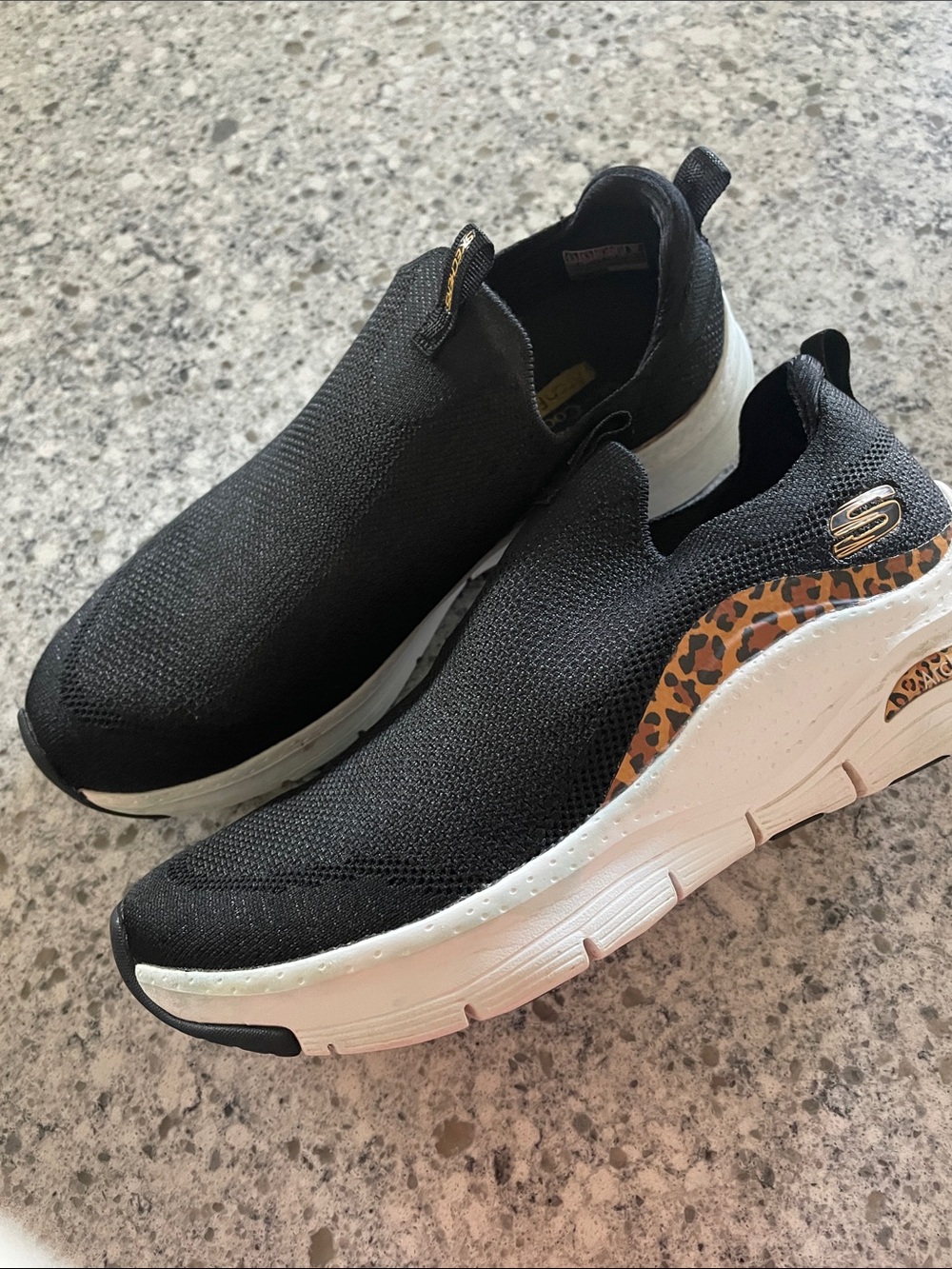 Skechers Women’s Black Slip-On Sneakers with Leopard Accent